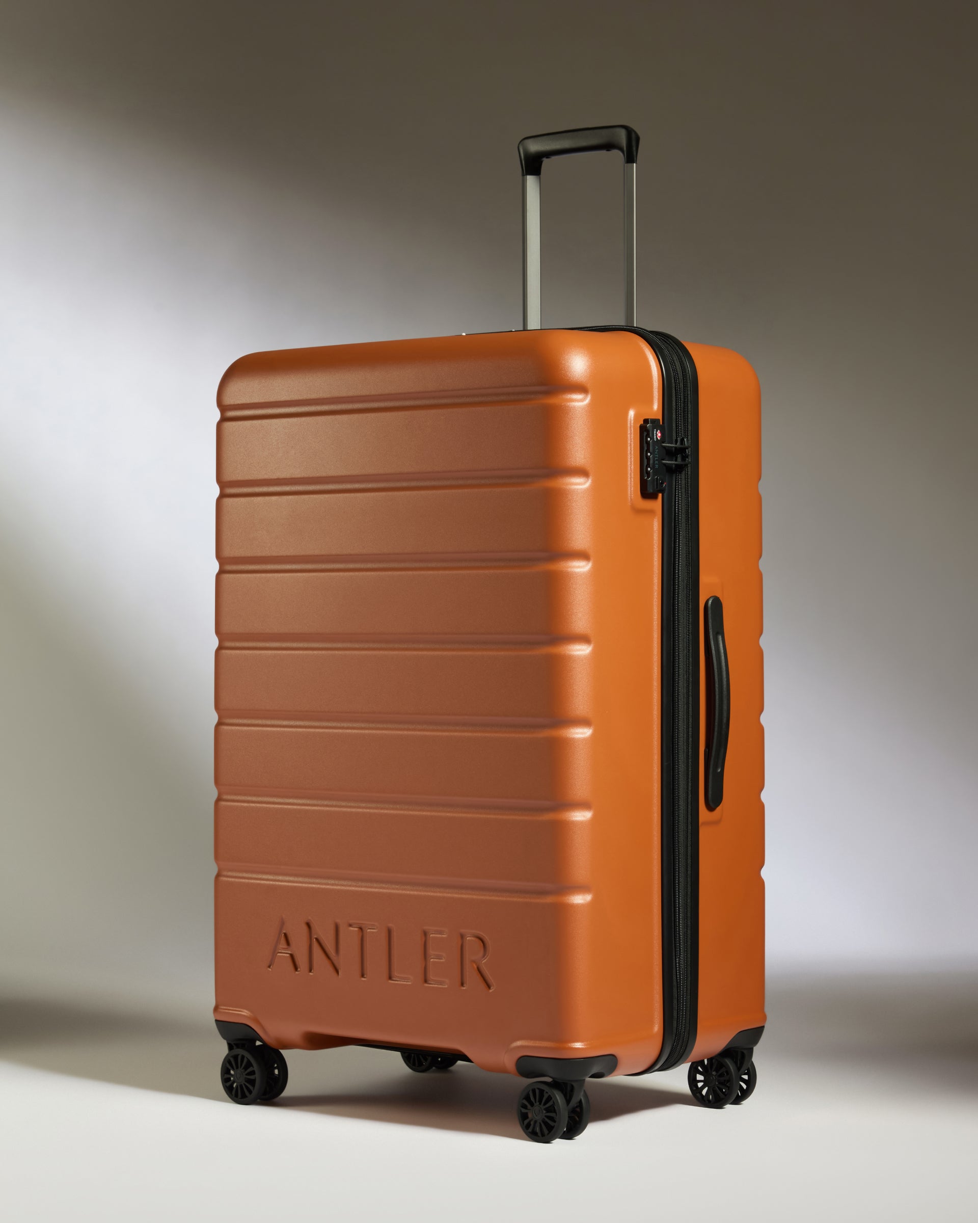 Large Suitcase in Amber Logo Lightweight Hard Shell Luggage Antler Luggage Australia