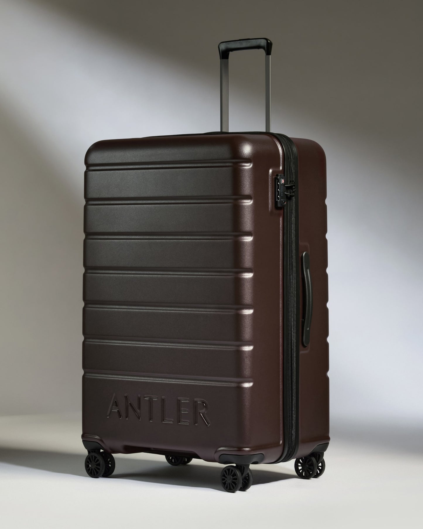 Large Luggage in Cedar Brown - Logo