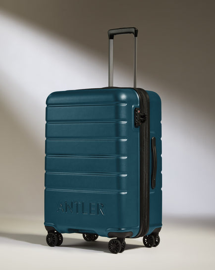 Medium Luggage in Soft Blue - Logo