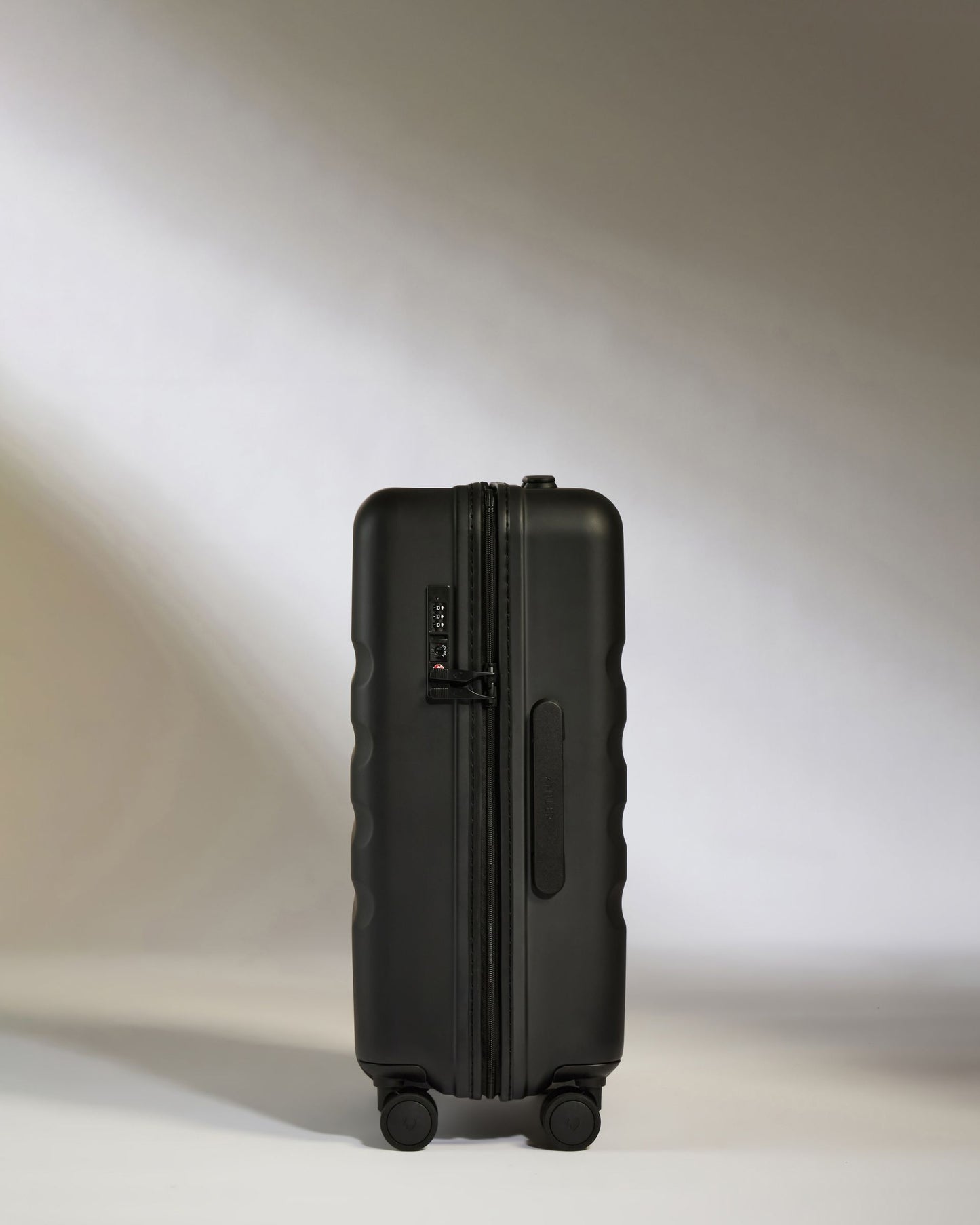 Large Carry-on Luggage in Black - Icon Stripe