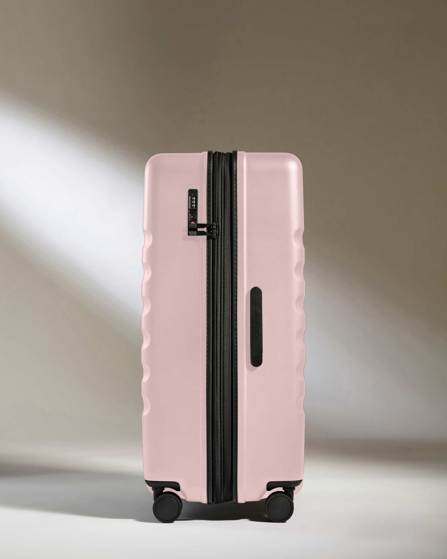 Large Suitcase in Moorland Pink - Icon Stripe