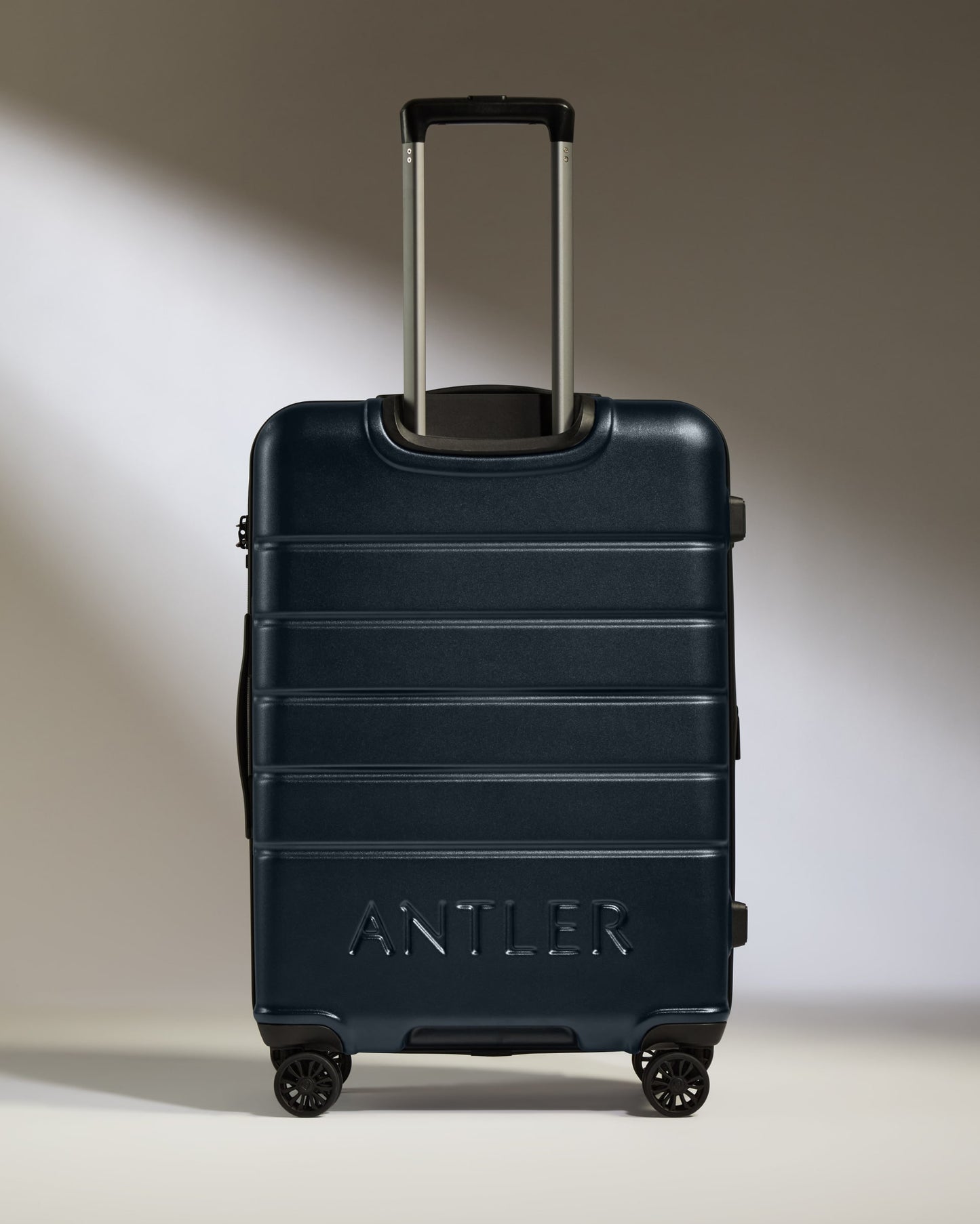 Medium Luggage in Dark Navy - Logo