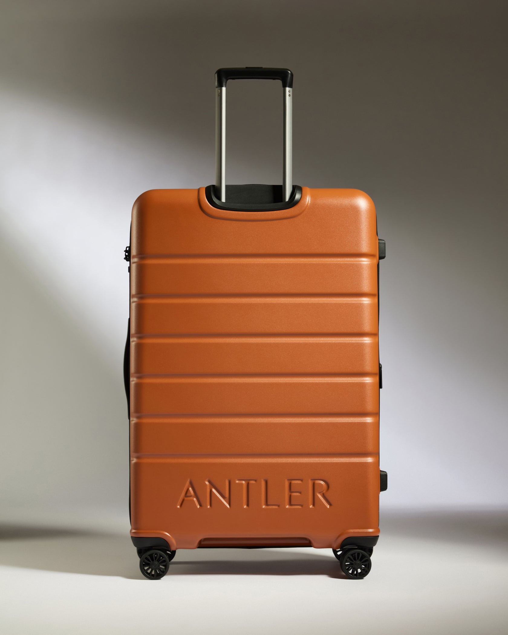 Large Suitcase in Amber - Logo | Lightweight Hard Shell Luggage ...