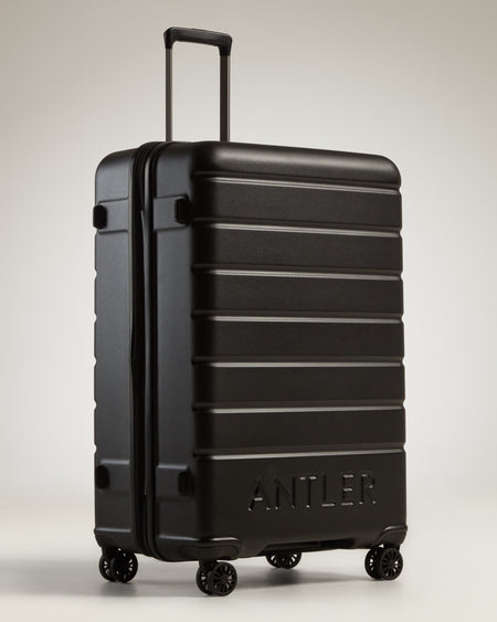 Large Luggage in Black - Logo